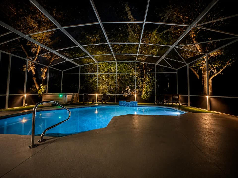 Screened pool enclosure and deck lighting in Central Florida