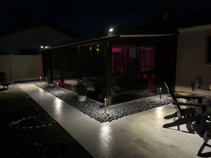 Porch and brick pathway lighting at night in Central Florida